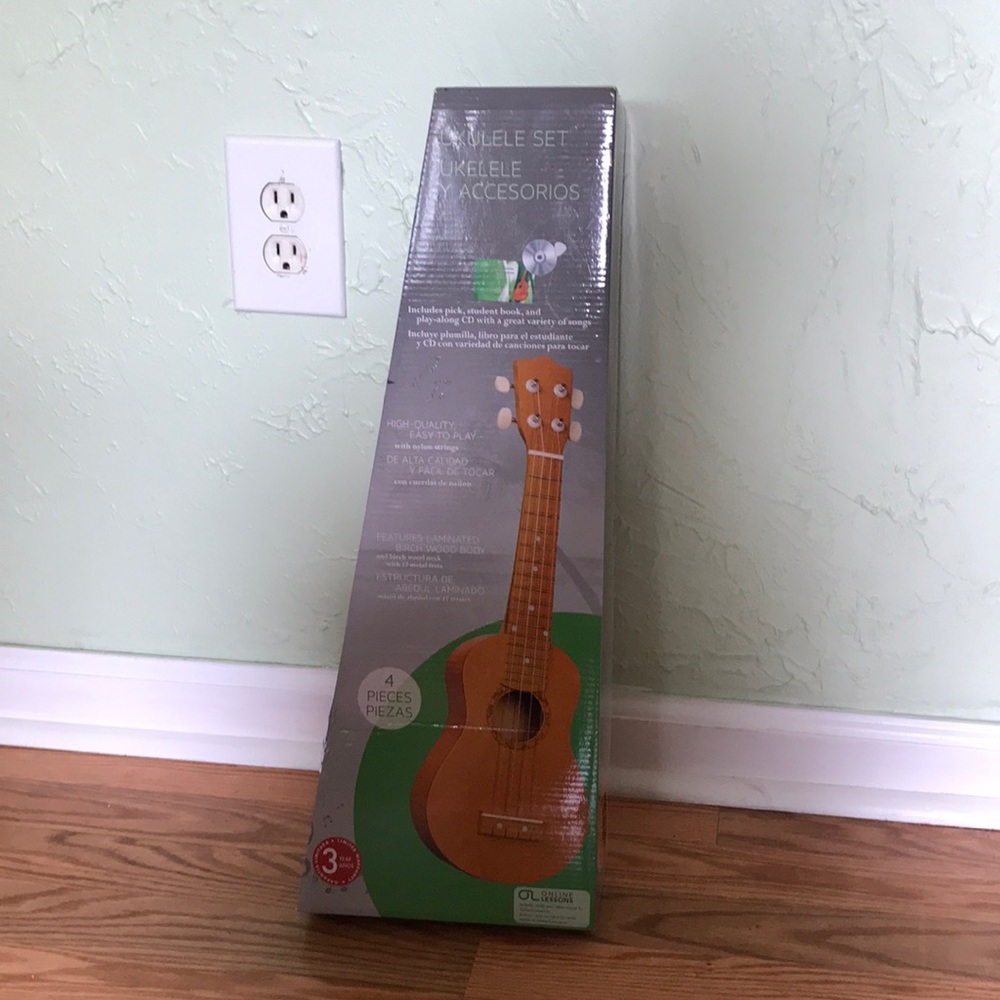Never used Ukulele with cd and pick